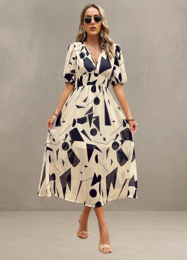 ASTELLA | ROBE MIDI FLORALE FLATTEUSE