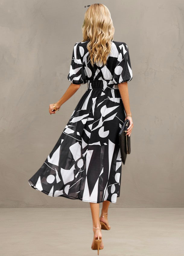 ASTELLA | ROBE MIDI FLORALE FLATTEUSE