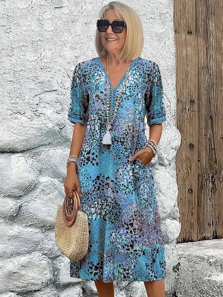 Susan | Robe Midi Imprimé Floral Sauvage Col V & Manches Courtes